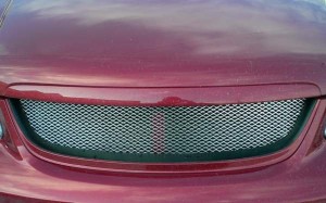 На фото - новая решетка радиатора Киа Спектра, exist-tuning.ru